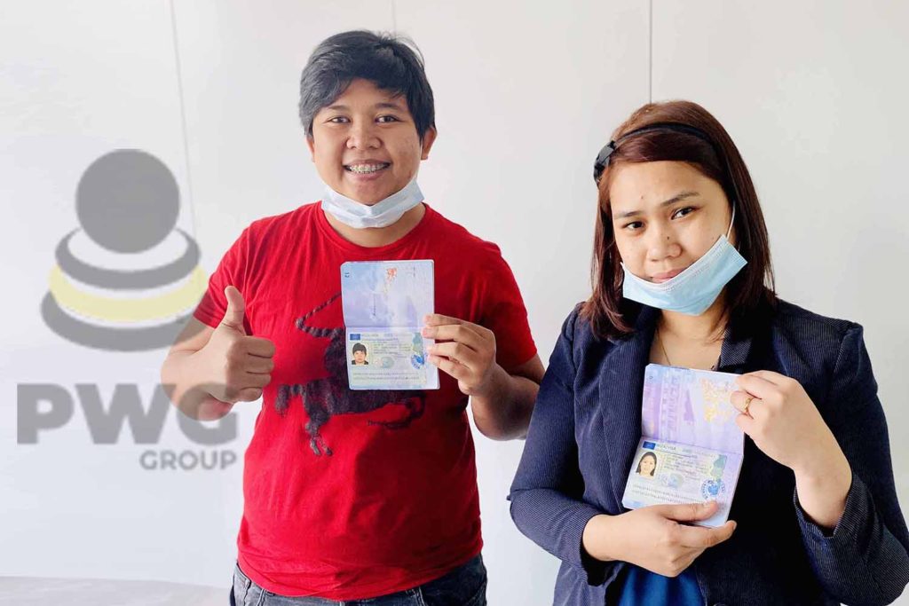 Two-ladies-showing-their-passport-visa-details