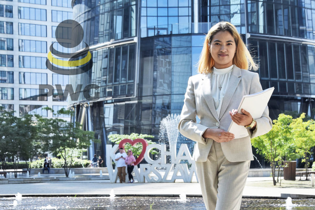 A formally dressed lady holding a file